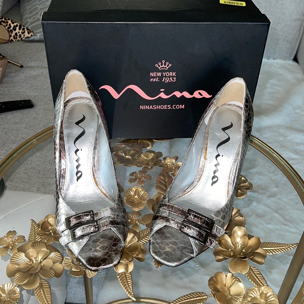 Nina open toe metallic silver with tan heel shoes.